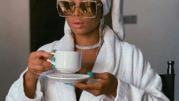 Fancy looking girl drinking tea